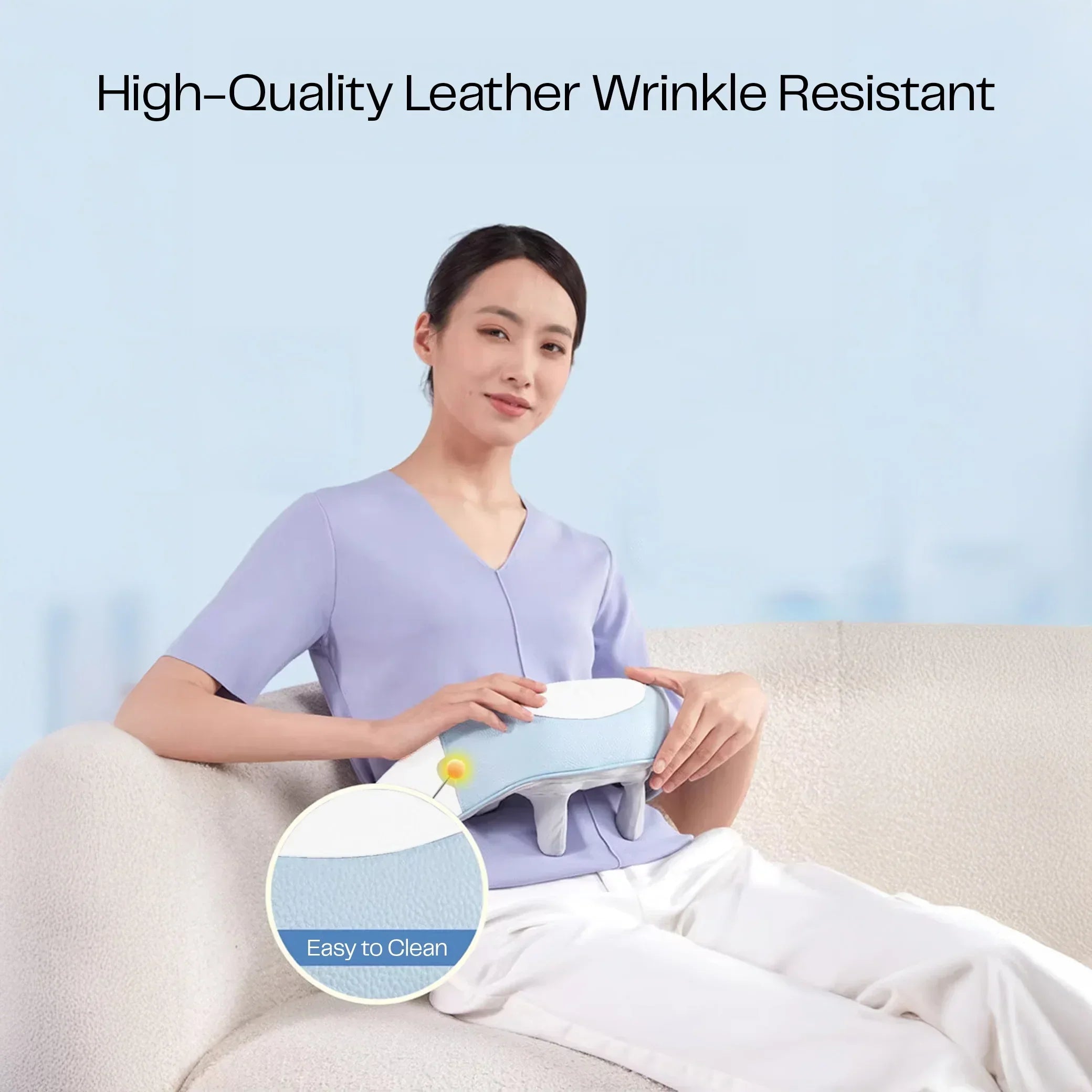 Woman sitting on sofa holding K35 Pro neck massager, high-quality leather, easy to clean