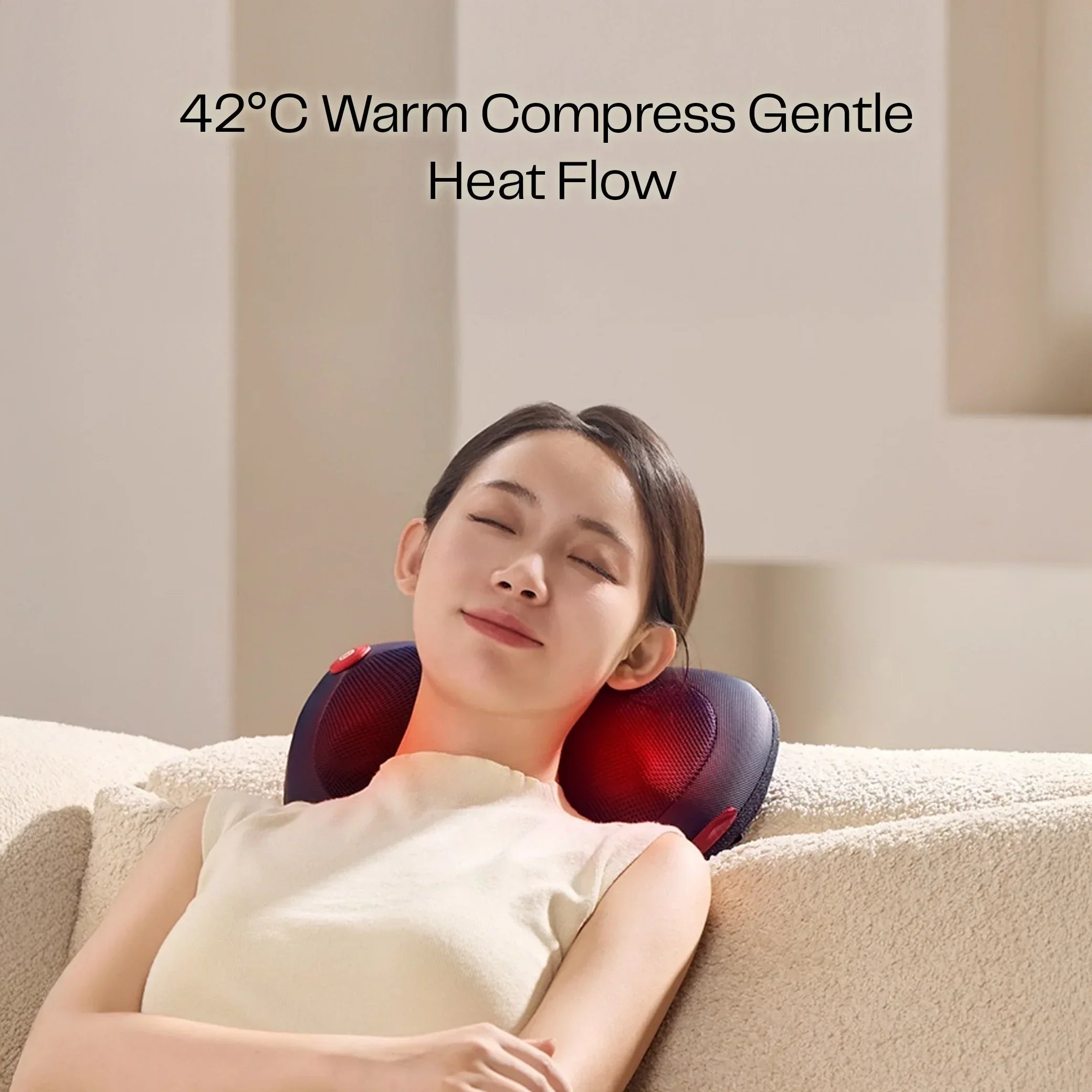 Woman relaxing on sofa with neck massager pillow, 42°C warm compress heat therapy