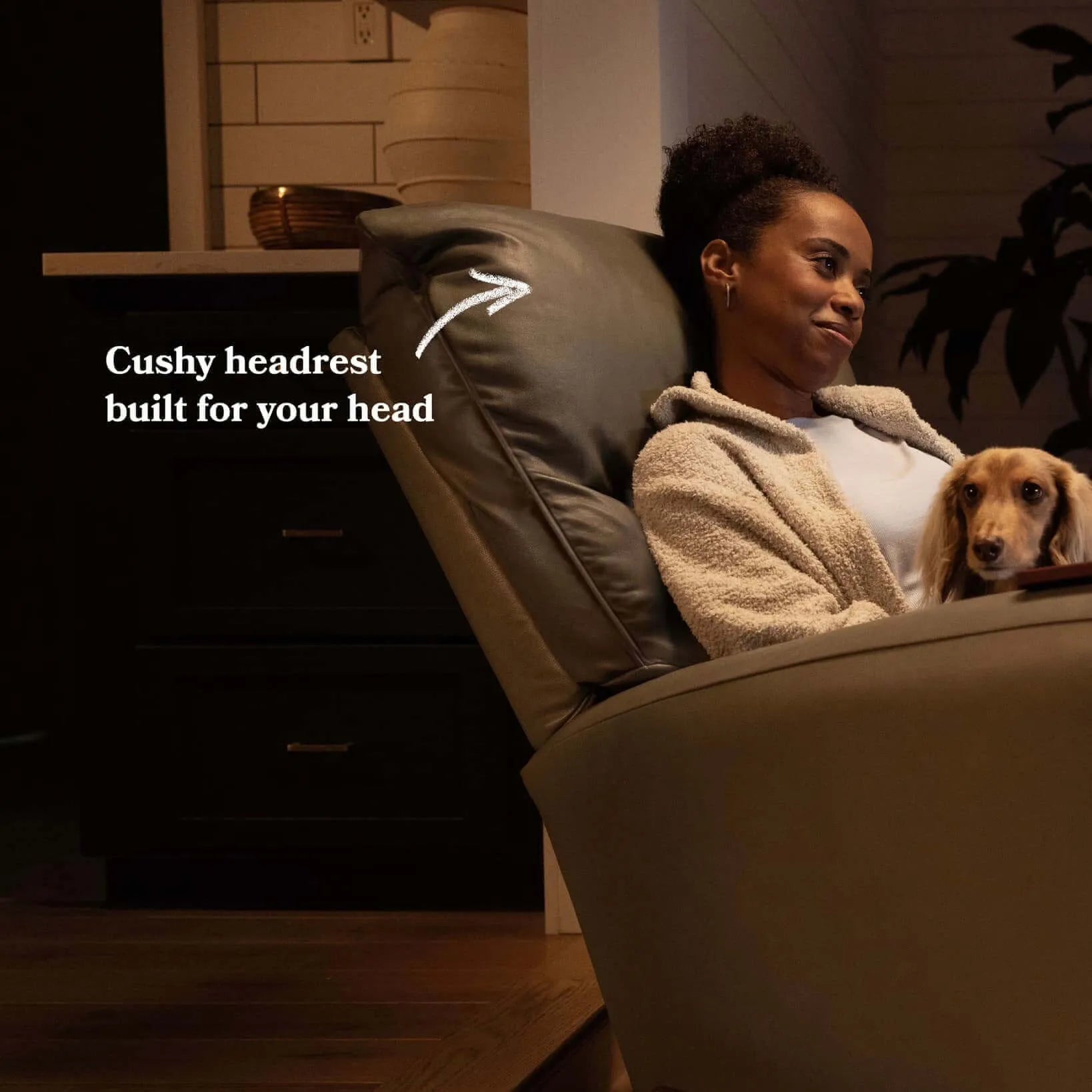 Woman relaxing in Lazy Boy Parker Recliner with cushy headrest, holding a dog, showcasing comfort and style in UAE. Best Recliners in UAE, Buy recliners UAE, fast delivery, Buy Lazy Recliner Chair, Lazy Boy Recliner, Buy Recliner online in UAE, Recliner U