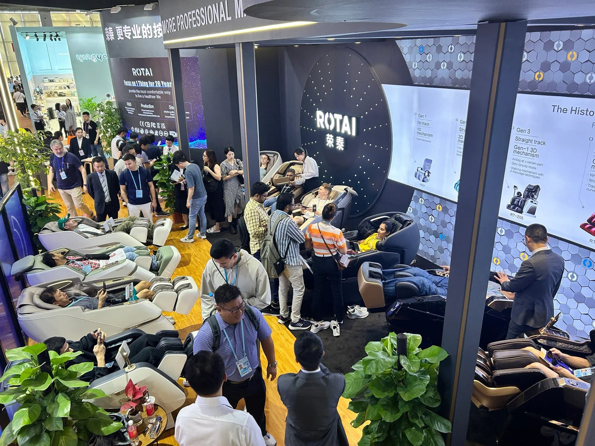 Visitors testing ROTAI massage chairs at an international trade fair
