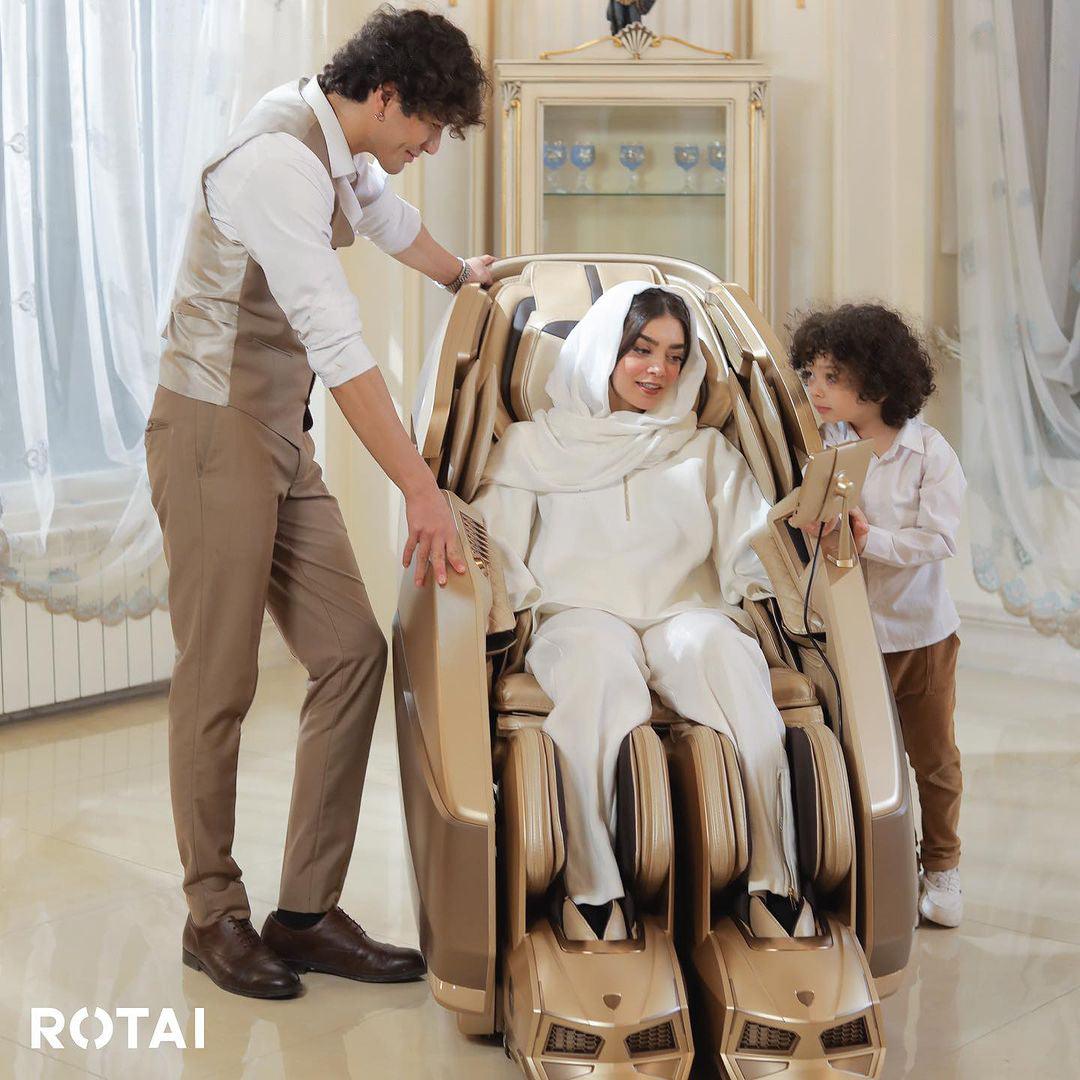 Family enjoying a relaxing session on the AI Robotic Massage Chair in Sleek Golden at a massage chair shop in Dubai, UAE.