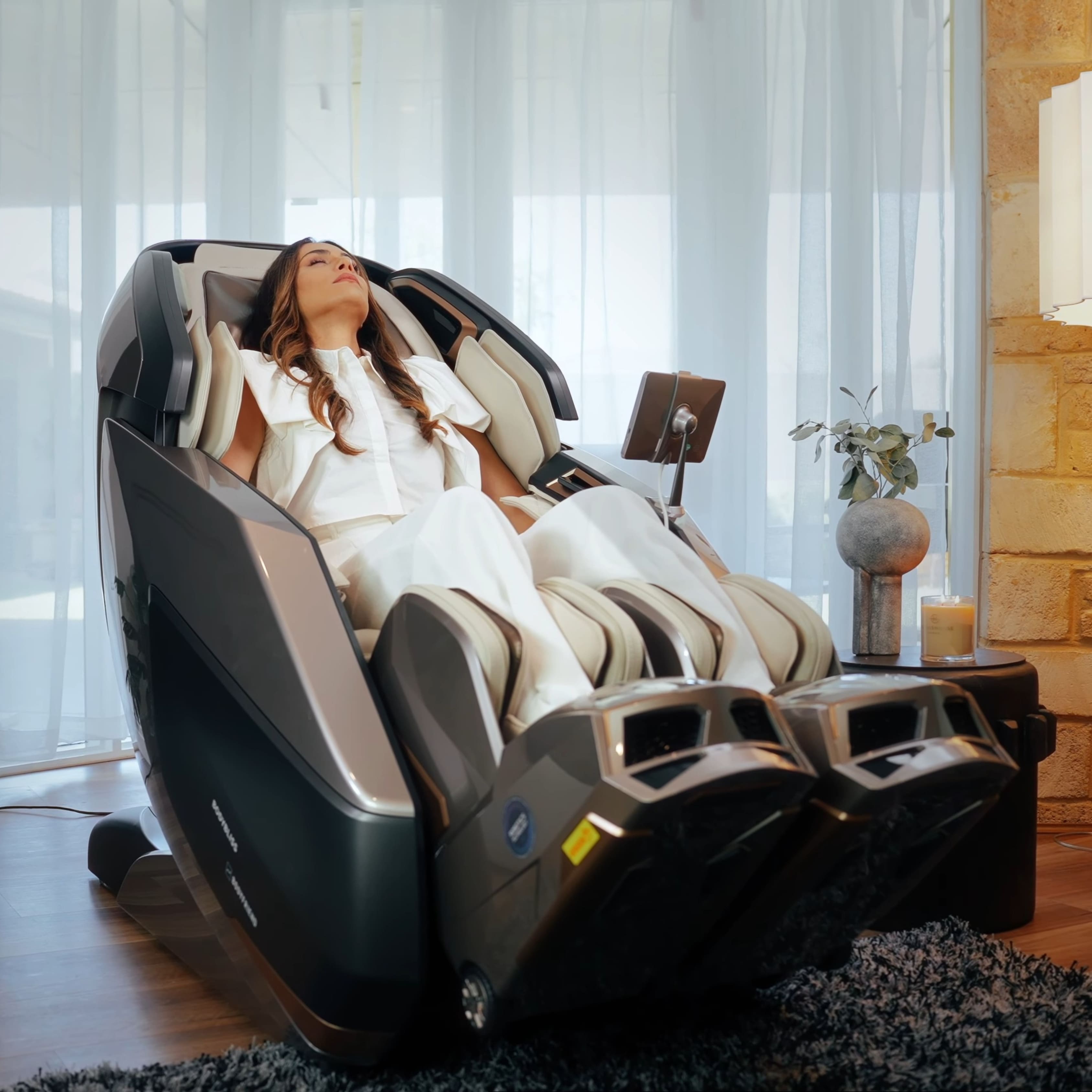 Woman enjoying Rotai AI Robotic Massage Chair (Glacier Silver) Best massage chair brand Dubai, uae, Saudi Arabia, كرسي التدليك