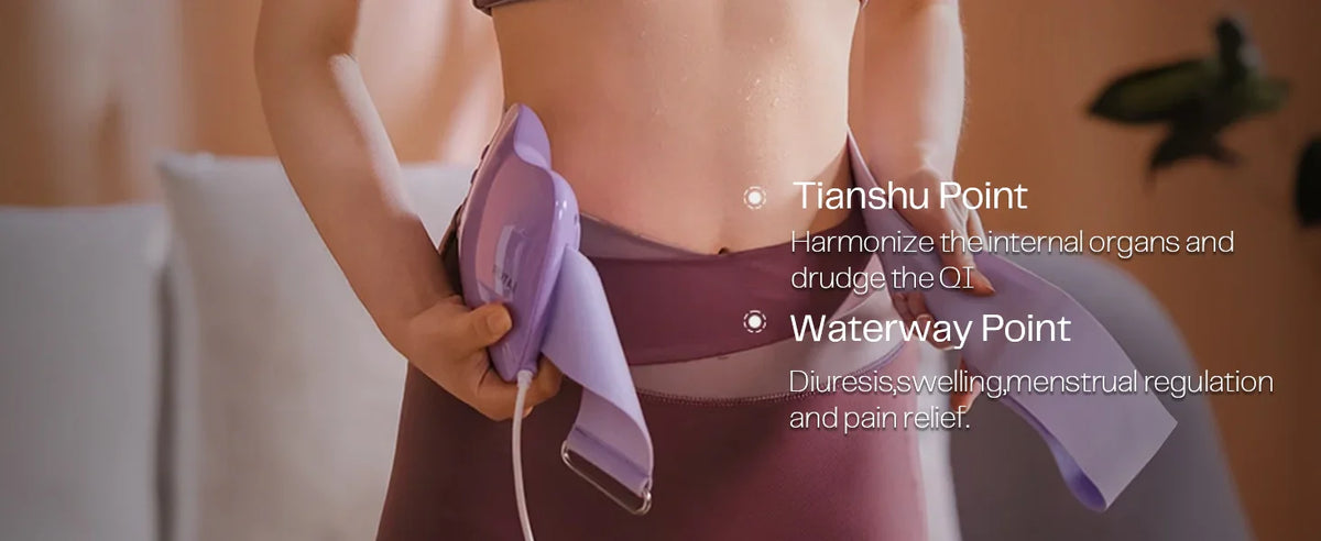 Woman using a slim waist massager on abdomen in a cozy home setting